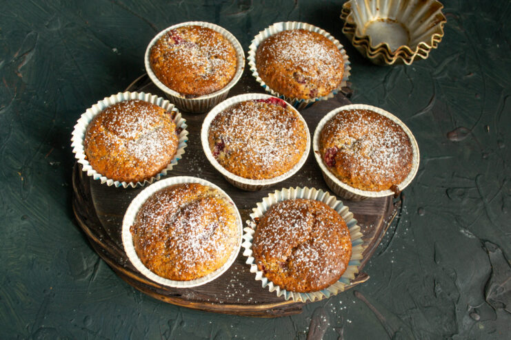 Finished muffins lightly dusted with powdered sugar and ready to be served.