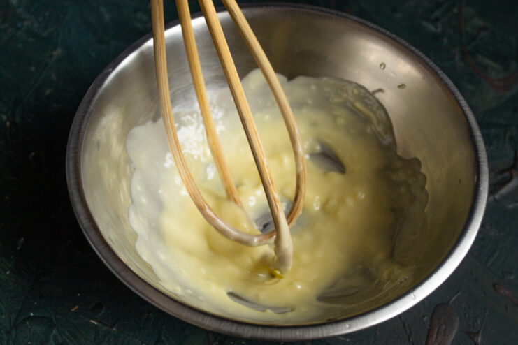 Whisking The Butter Whisking softened room temperature butter in a metal mixing bowl