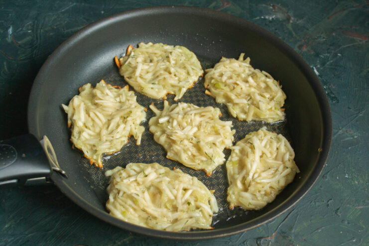 Frying process Frying vegetable fritters in a hot skillet with oil