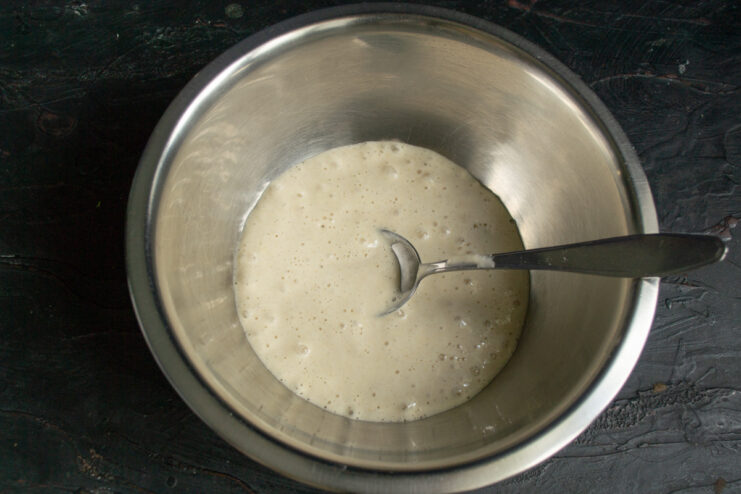 Preparing the sourdough starter Active sourdough starter in a metal bowl