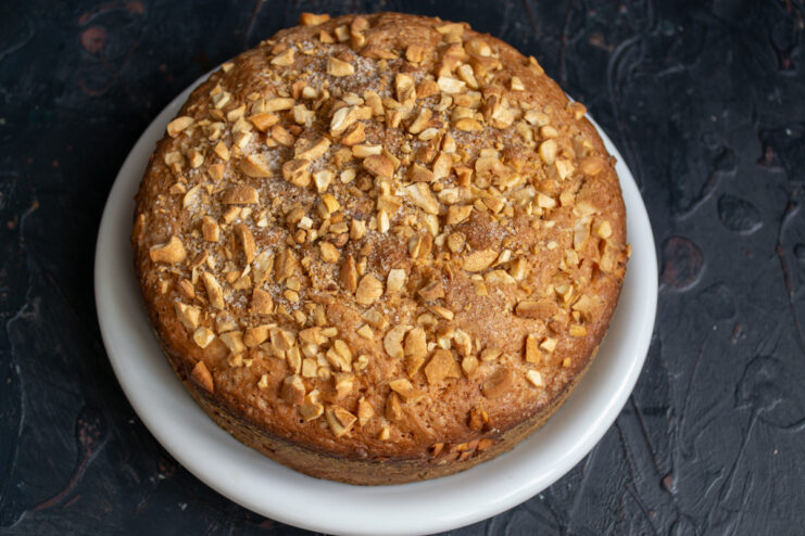 Cake ready to serve Whole baked kefir cake on a white serving plate