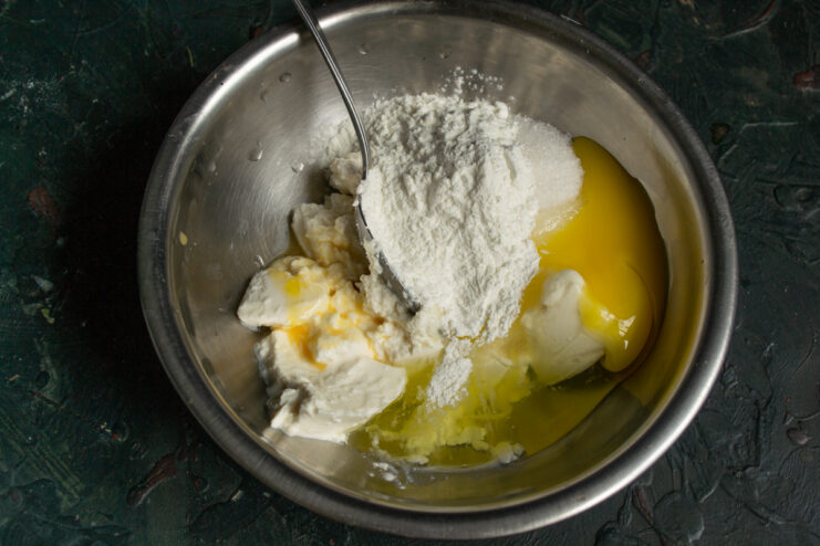 Adding cornstarch Adding cornstarch to the creamy tart filling