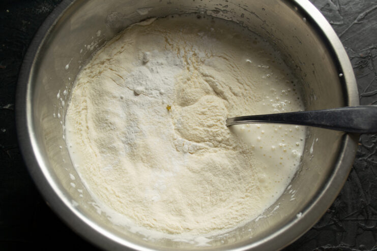 Folding in the flour Adding wheat flour to the fluffy whipped egg base