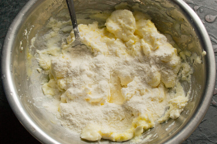 Adding all-purpose flour to the cheese mixture