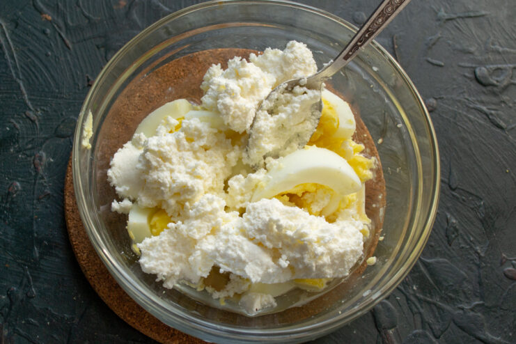 Cream cheese for thickness Adding cream cheese to the egg and mustard mixture