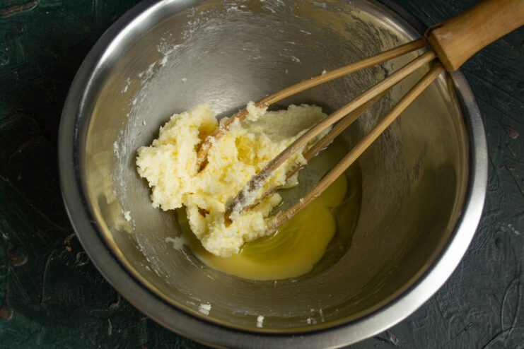 Adding Egg To Butter Mixture Adding beaten egg to butter mixture