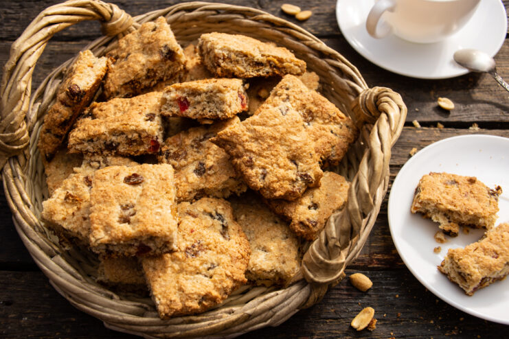 Homemade Mazurka cookies with nuts and dried fruits in a wicker basket