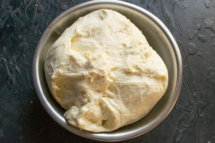 First dough rise Yeast dough completely doubled in volume inside a mixing bowl after the first rise