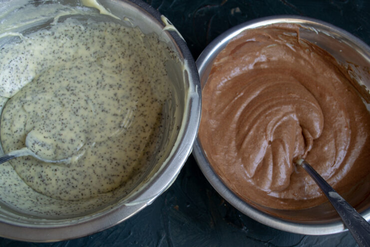 Prepared Batter Portions Two bowls containing the prepared poppy seed and chocolate batters
