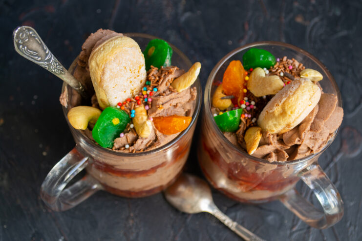 The fully assembled and decorated chocolate ricotta mug dessert ready to be served.