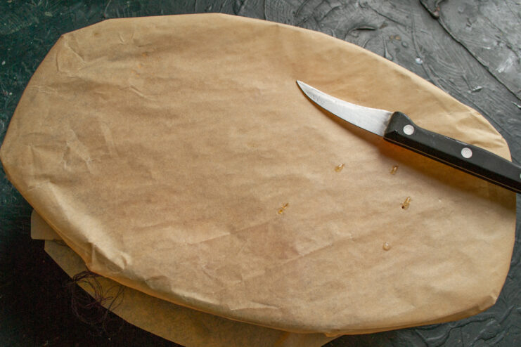 Preparing to bake Baking dish covered with pierced parchment paper