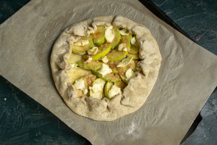 Assembling the Galette Folding dough edges over filling to form a galette