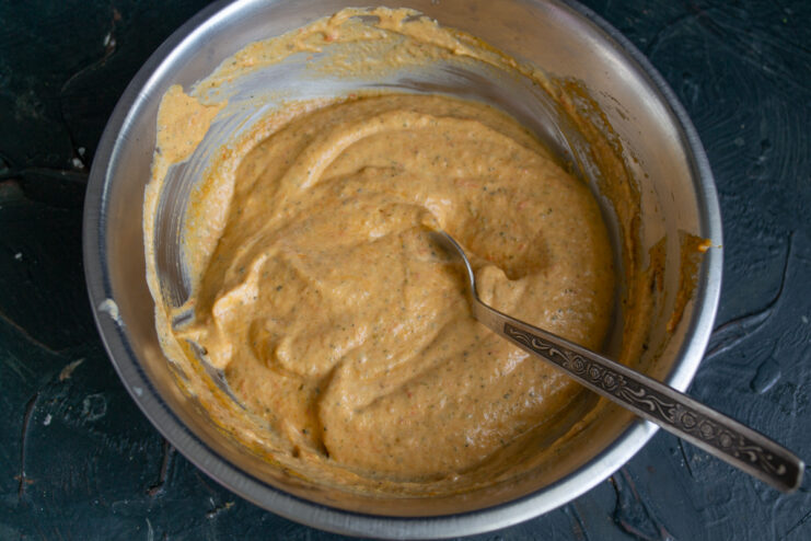 Mixing the Ingredients Smooth pastel-colored zucchini and cheese spread perfectly mixed in a bowl