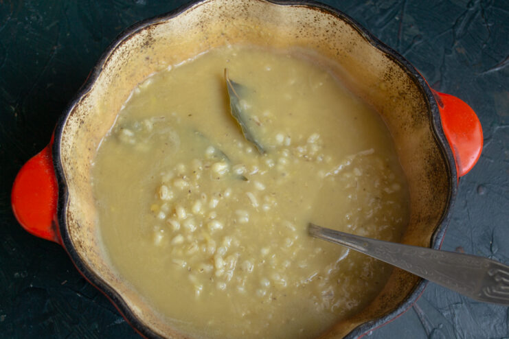 Cooked Barley and Lentil Base Fully cooked pearl barley and lentil stew inside a pot