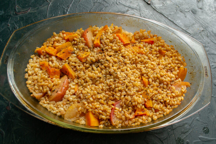 Finished farro Cooked dish of farro, meat, and pumpkin fresh from the oven