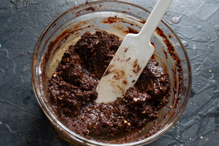 Mixing the chocolate dough Thick and cohesive dark chocolate dough mixed together in a bowl