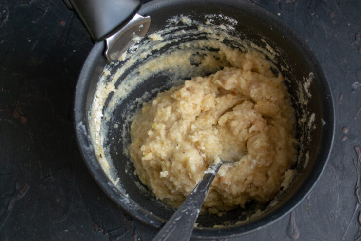Texture of the finished dough Thick rested bean dumpling dough ready for shaping in a pot