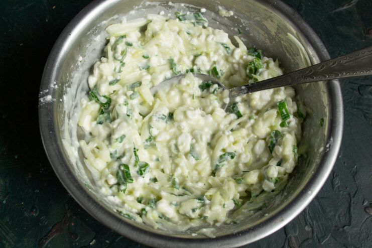 Resting the batter Thick ready-to-bake batter for zucchini casserole resting in a bowl