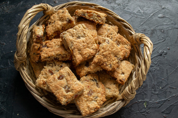 Storing and serving the cookies Finished Mazurka cookies in a woven basket on a dark background