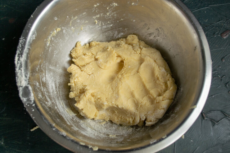 Shortcrust pastry Finished ball of shortcrust pastry dough in a metal mixing bowl