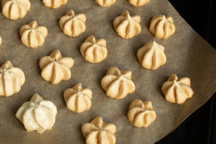 Baked meringue Crispy baked meringues resting on parchment paper