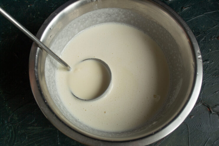 Smooth and liquid crepe batter sitting in a bowl