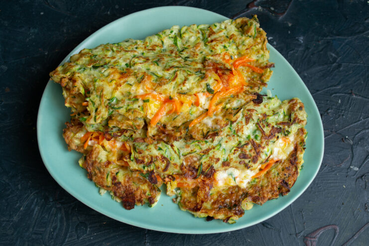 Serving the dish Hot zucchini pockets ready to be served on a plate.
