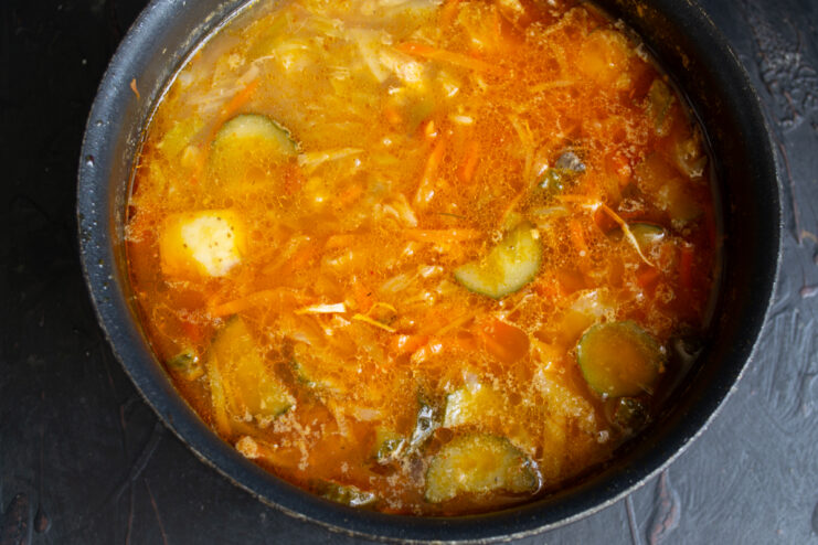 Finished Soup In The Pot Finished mushroom rassolnik in a pot, top view.