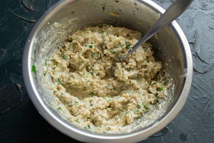 Oat Patty Mixture Thick savory oat patty batter mixed in a bowl ready for frying