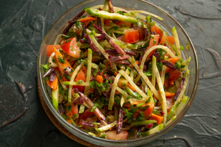 Final Plated Dish Mixed radish and carrot salad served in a deep bowl