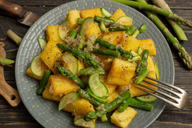 Finished polenta and asparagus salad served on a plate
