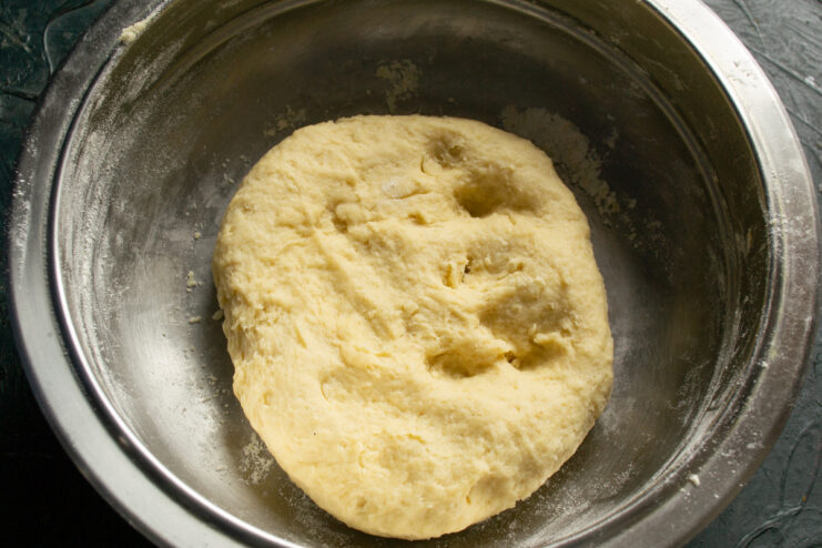 Chilling the Dough A smooth ball of shortcrust pastry dough resting in a bowl