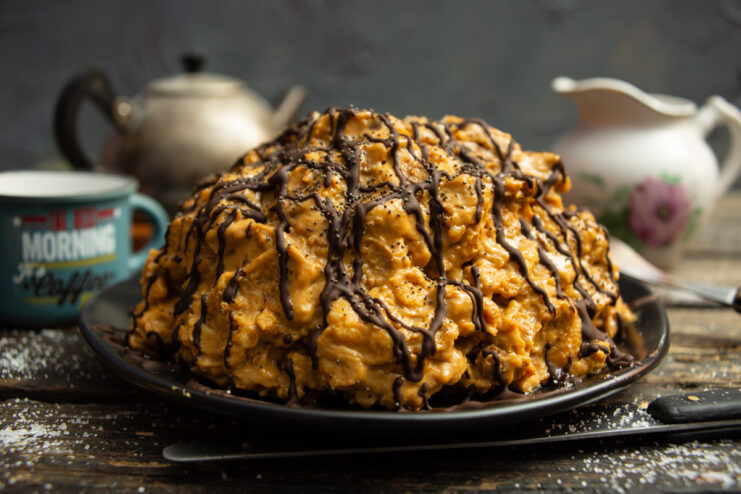 Finished Anthill cake decorated with melted chocolate and poppy seeds