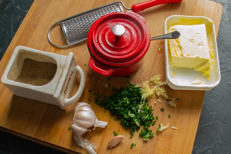Softened butter, fresh parsley, and garlic cloves for the filling