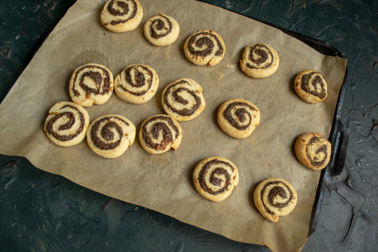 Fresh From the Oven Freshly baked golden poppy seed cookies on a baking tray