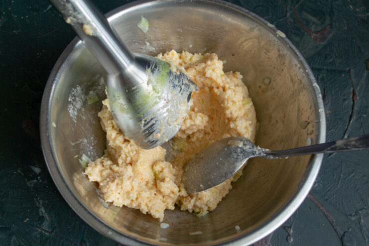 Blending the mixture into a thick, uniform dough