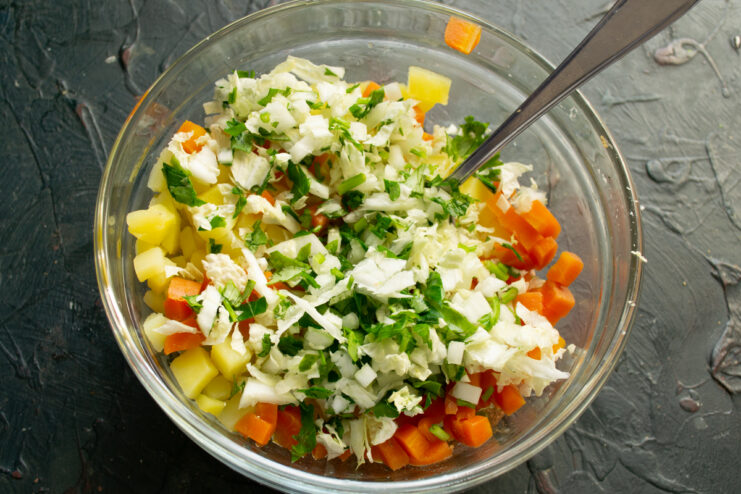 Greens and Napa cabbage Chopped Napa cabbage and parsley scattered over vegetables