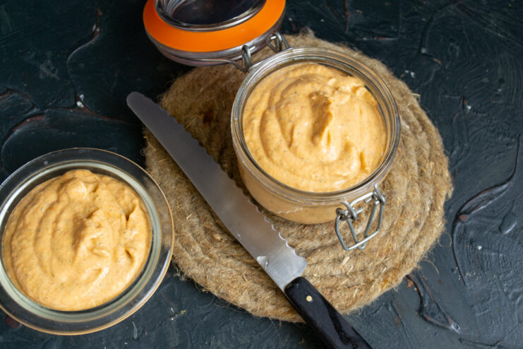 Storing the Spread Finished zucchini spread stored in a clear glass jar and a small serving bowl