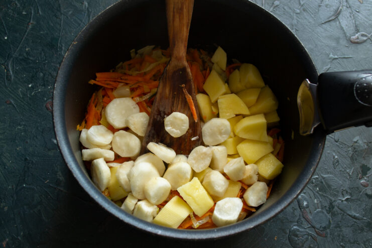 Vegetables for the soup Diced potatoes and Jerusalem artichokes added to sautéed vegetables
