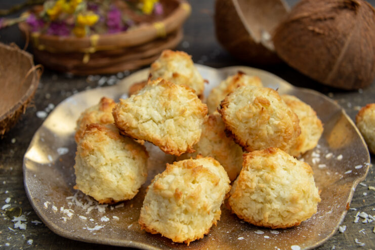 Flourless coconut macaroons served on a decorative white plate.