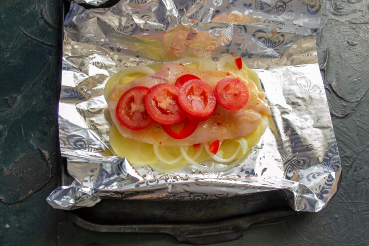 Tomato layer Tomato slices layered over chicken fillet