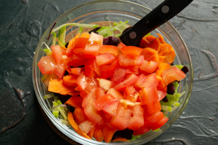 Fresh Tomatoes For Salad Diced red tomatoes added to carrots and radish