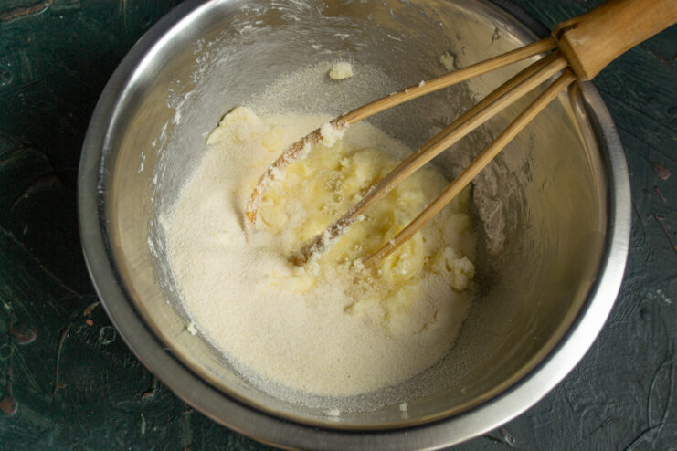 Adding Semolina To The Dough Semolina in a bowl with wet ingredients