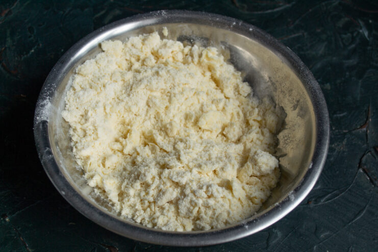 Cutting Butter Into Flour Creating coarse crumbs with flour and cold butter for shortbread dough