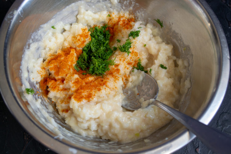 Seasoning With Herbs And Spices Ground paprika and freshly chopped dill sprinkled over the chicken and rice mixture.