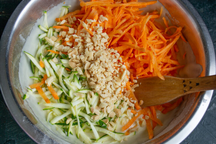 Carrots, zucchini, and peanuts incorporated into the cake batter