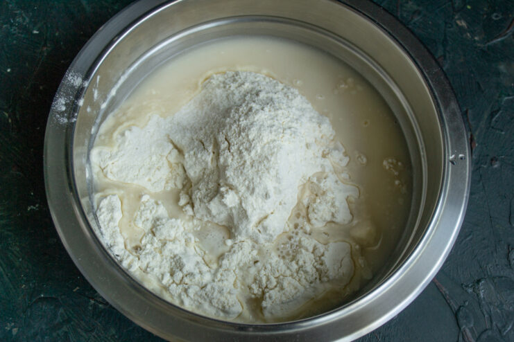 Dough ingredients Flour, water, and olive oil in a mixing bowl