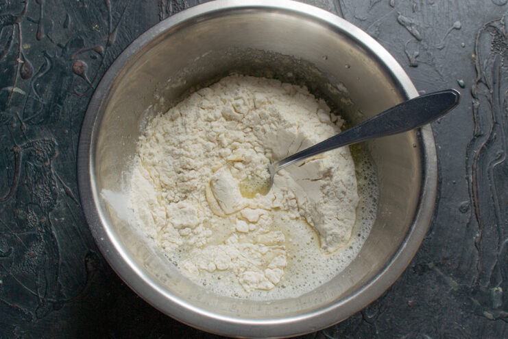 Pouring flour into the wet batter base