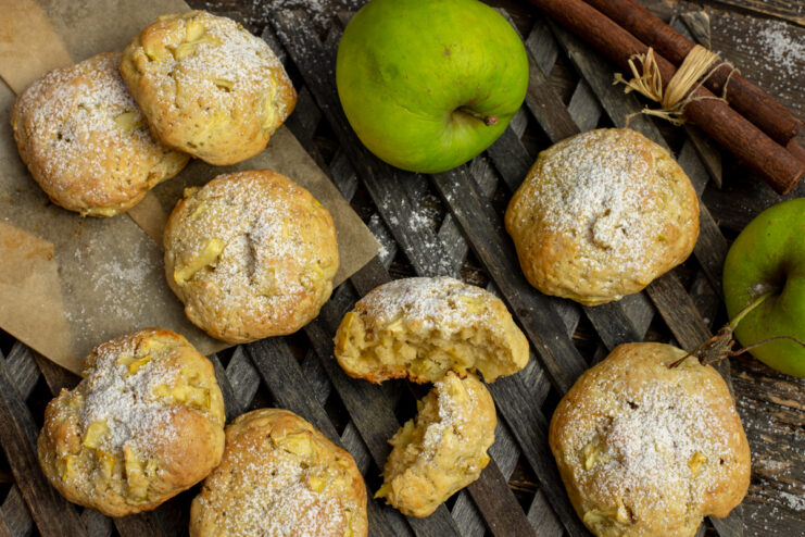 Soft baked apple cookies dusted with powdered sugar and cinnamon