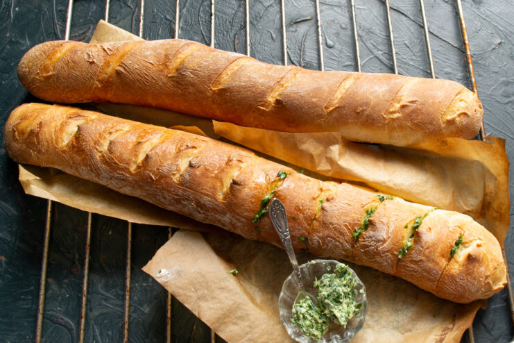 Stuffing garlic herb butter into bread slices